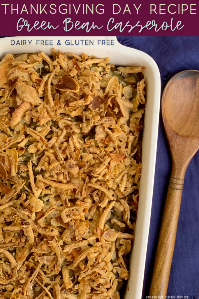 A baking dish with creamy mushroom soup. green beans, and crispy French fried onions on top.