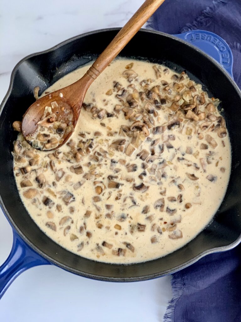 The mushroom mixture starting to thicken up with cornstarch and liquids.