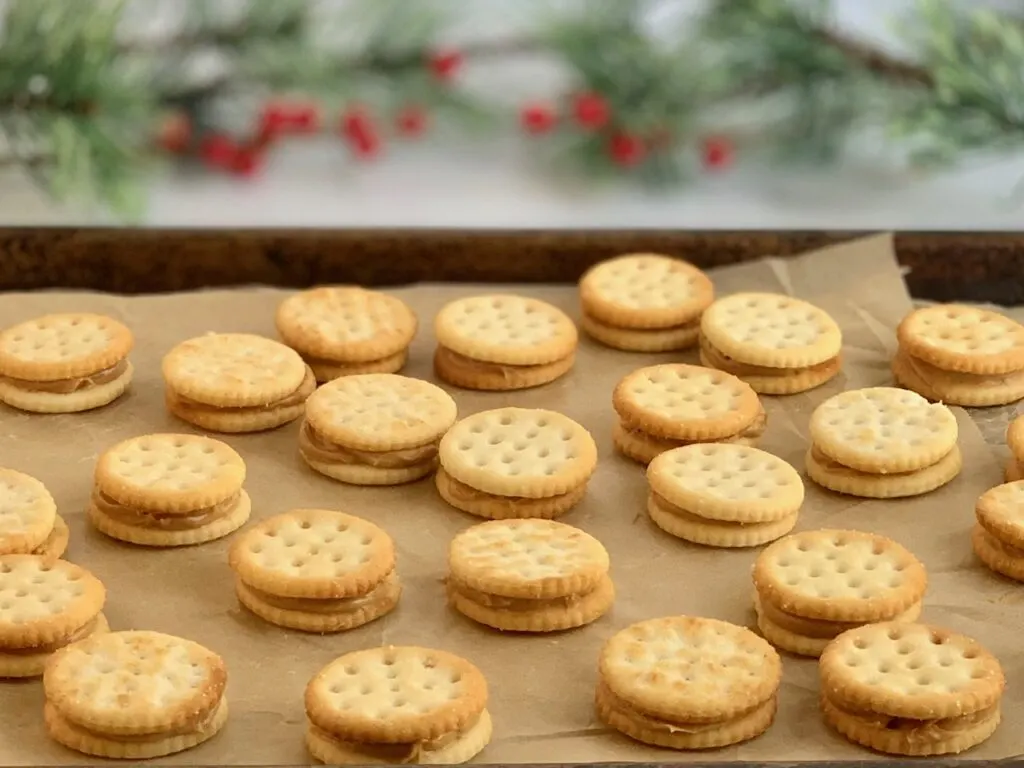 Peanut butter squished between two crackers. 