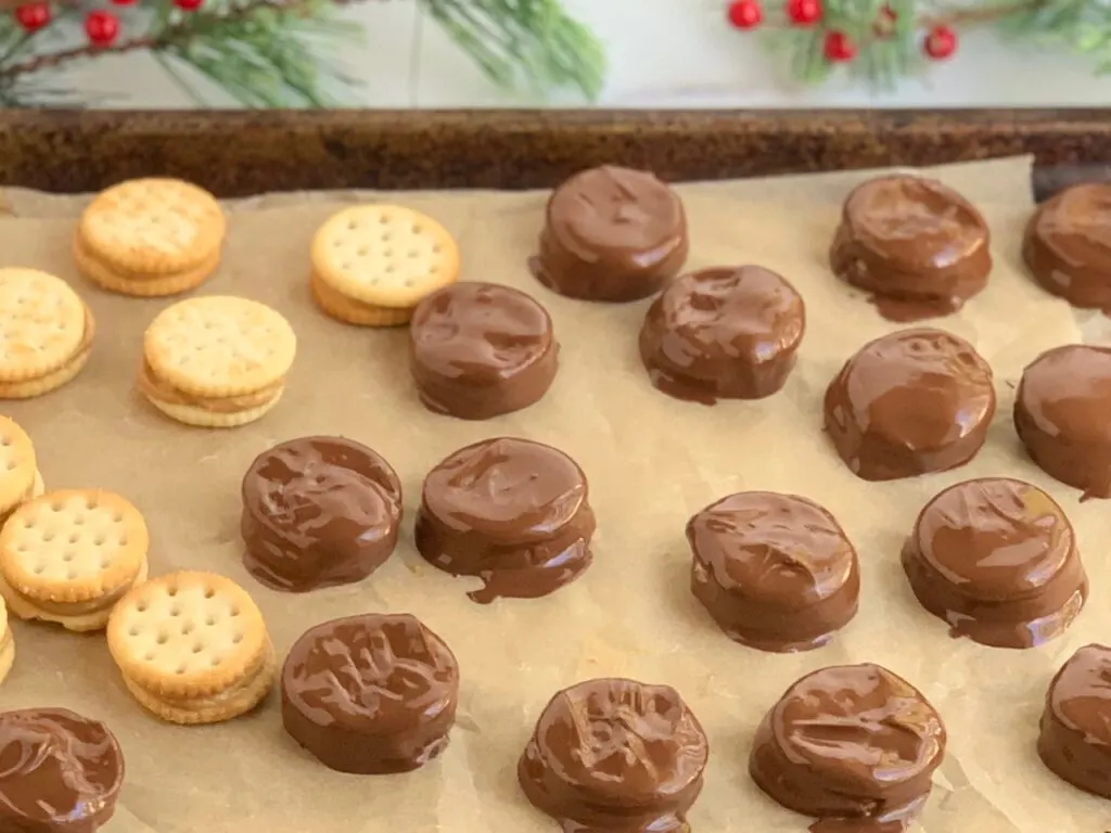 Peanut butter squished between two crackers and dipped in melted chocolate.