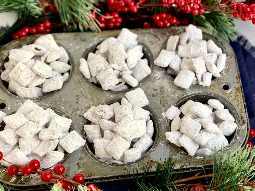 A muffin tin full of puppy chow
