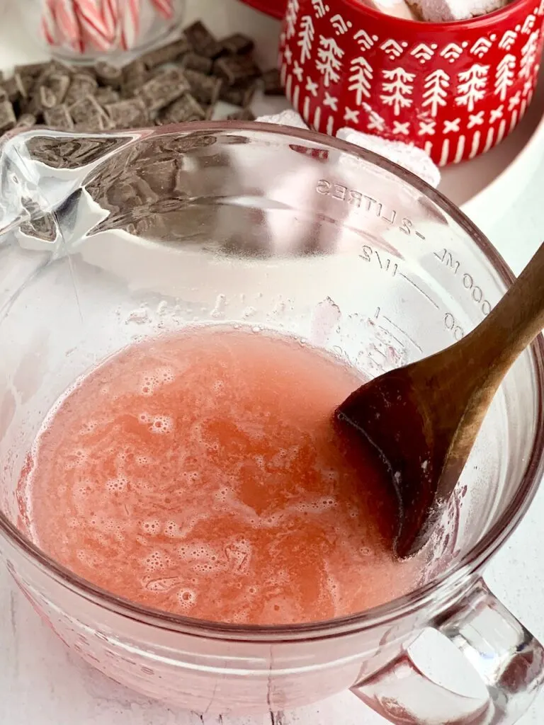 The peppermint sugar mixture poured into a large bowl of the gelatin and water.