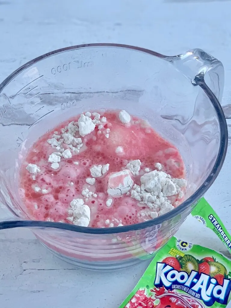 All the playdough ingredients in a glass mixing bowl. 