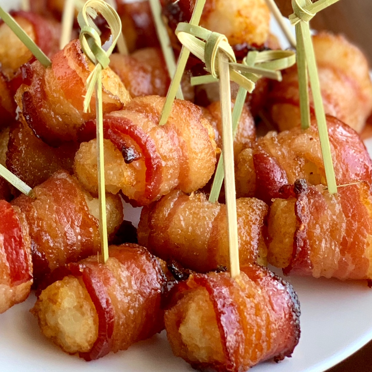 Bacon Wrapped tater tos with tooth picks.