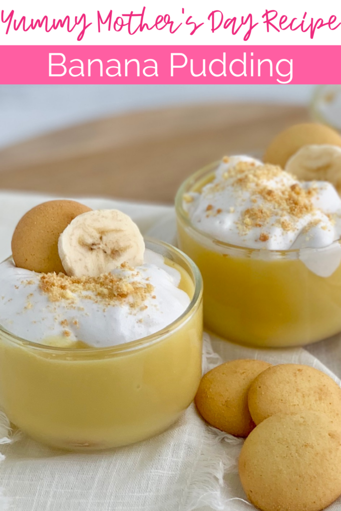 2 mini dessert glasses filled with layers of sliced bananas, vanilla wafer cookies, banana pudding, and creamy whipped topping. Then cookie crumbs, another cookie, and a banana slice on top of that.