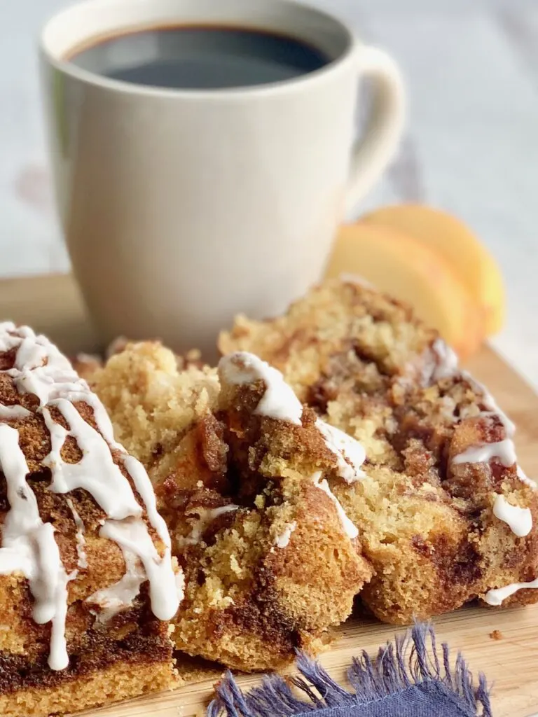 Two slices of bread with apple chunks and a white drizzle frosting.