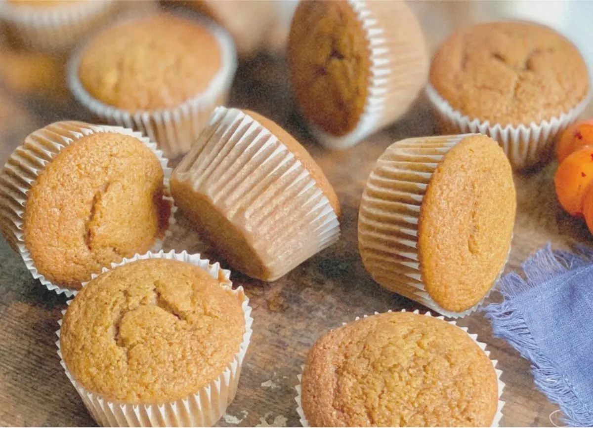 A bunch of gluten free dairy free pumpkin muffins on a serving platter.