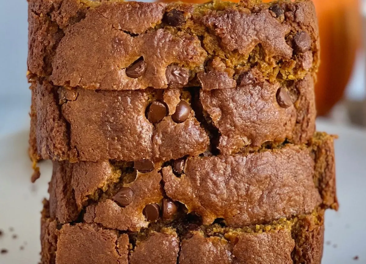 A plate of freshly sliced pumpkin chocolate chip gluten-free bread.