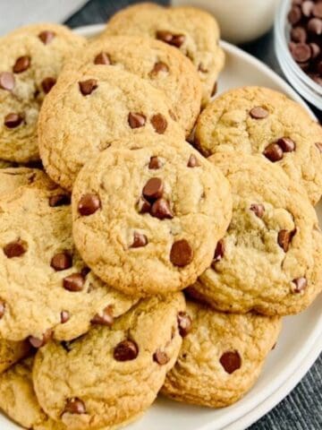 Delicious gluten and dairy free chocolate chip cookies on a white plate.
