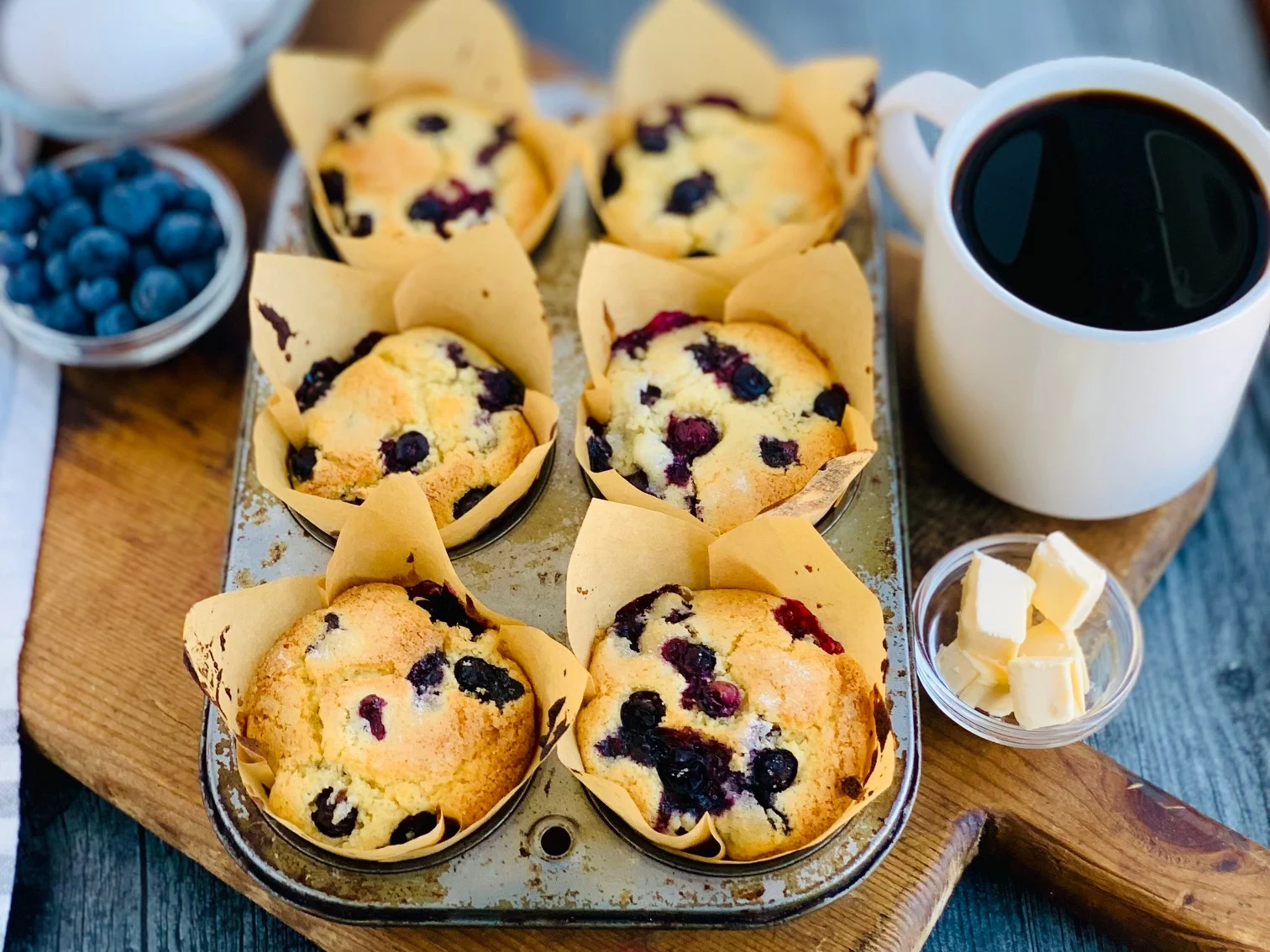 A muffin tin of blueberry gluten free muffins.