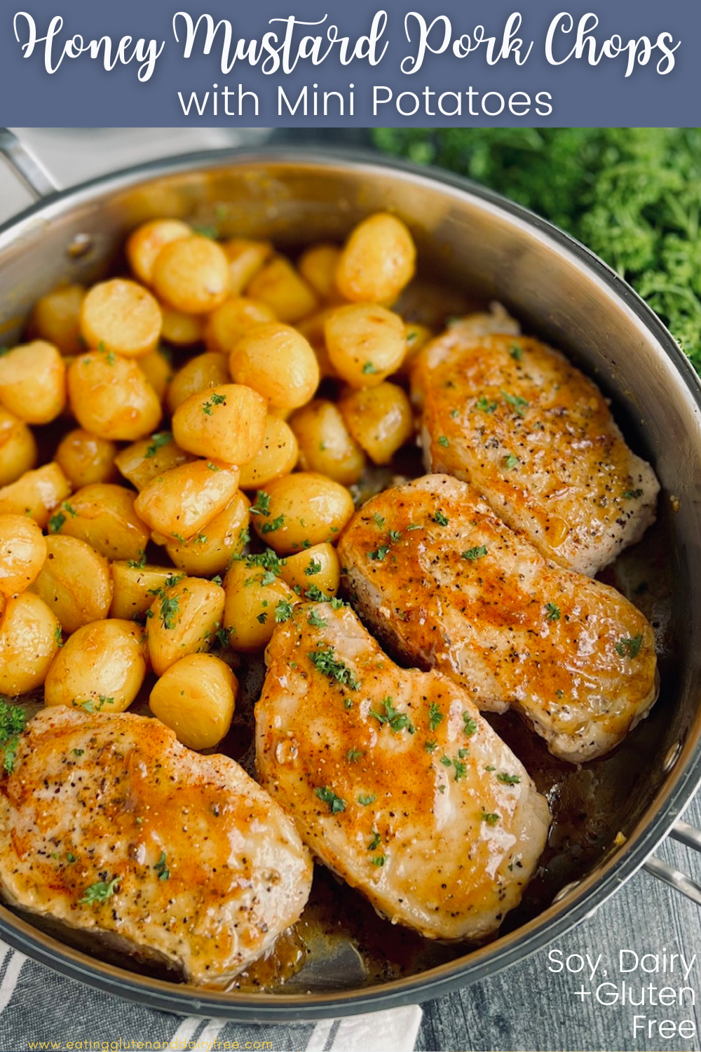 A skillet full of Honey Mustard Pork Chops with potatoes.