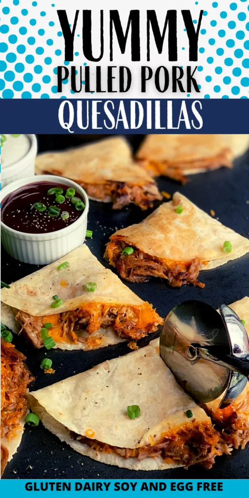 Several crispy looking tortillas with a brown pulled pork sticking out and yellow melted cheese on a black griddle next to a small bowl of BBQ sauce.