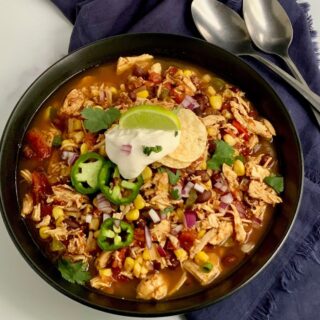 Bowl of taco soup with lime on top.