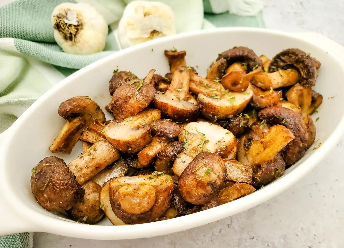 White dish of fried mushrooms.