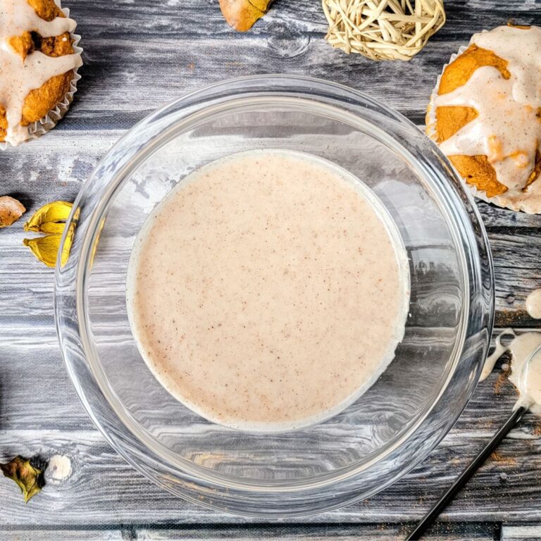 A glass bowl of gluten and dairy free sugar and cinnamon glaze for muffins.