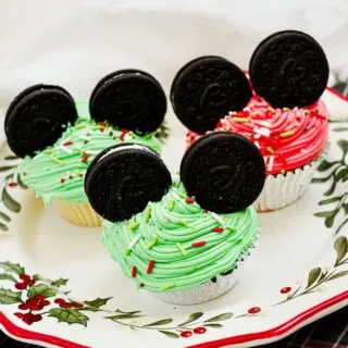 Mickey Mouse Ear Christmas Cupcakes on a Christmas plate.