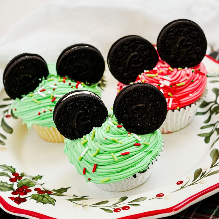 Mickey Mouse Ear Christmas Cupcakes on a Christmas plate.