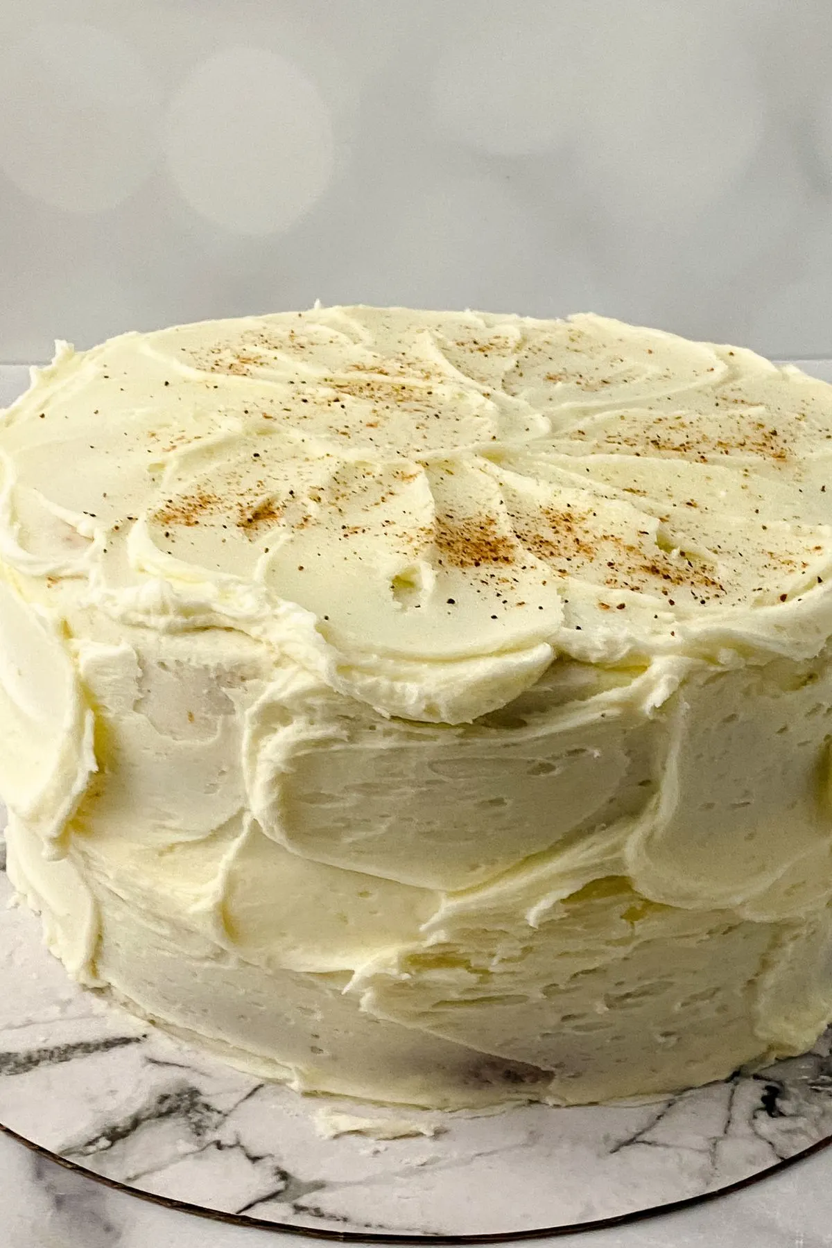 A gluten and dairy free eggnog cake with eggnog icing.