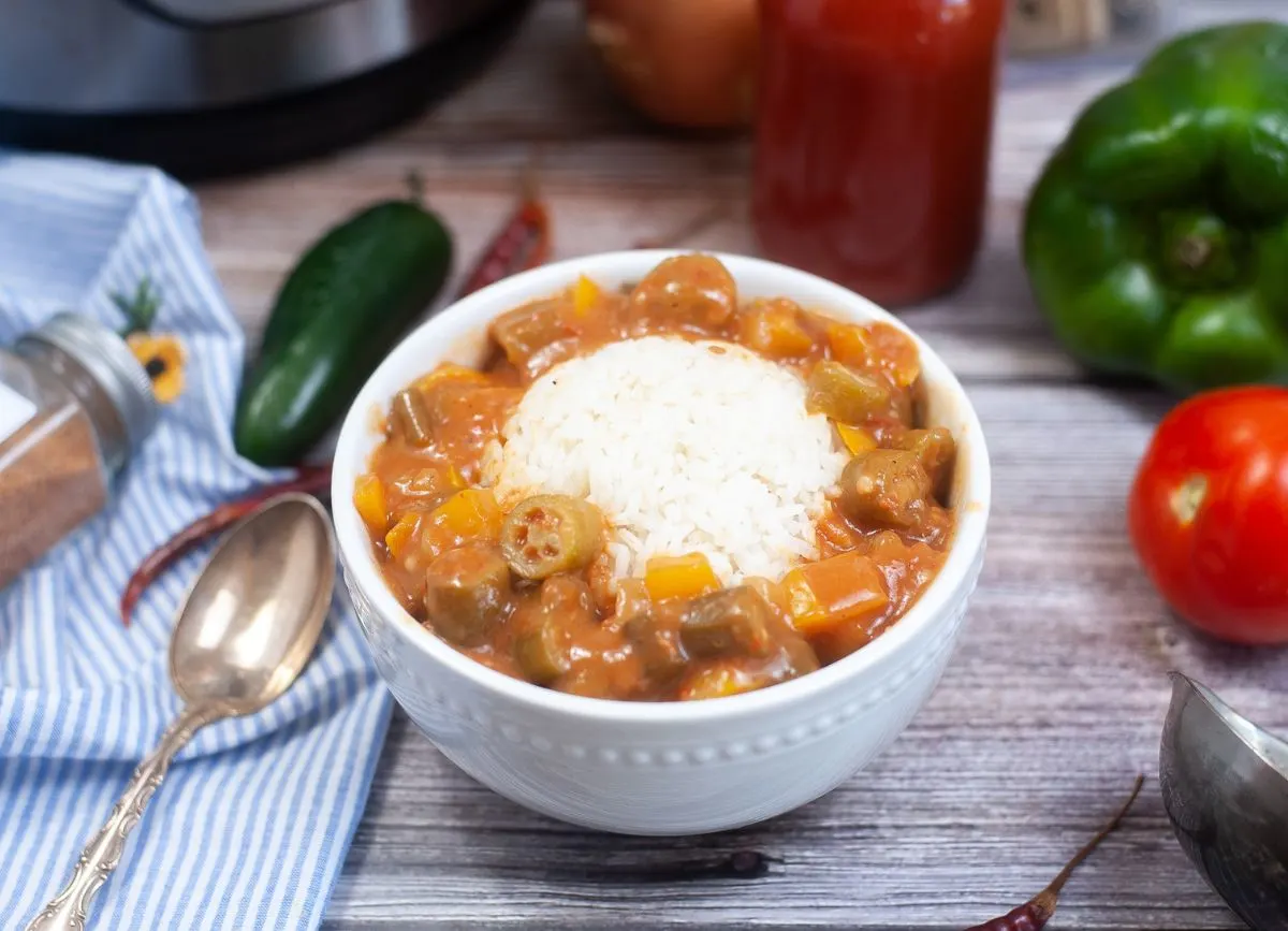 A bowl of gumbo with rice.