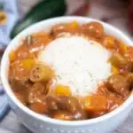 A bowl of gumbo and white rice, a gluten and dairy free dinner recipe.