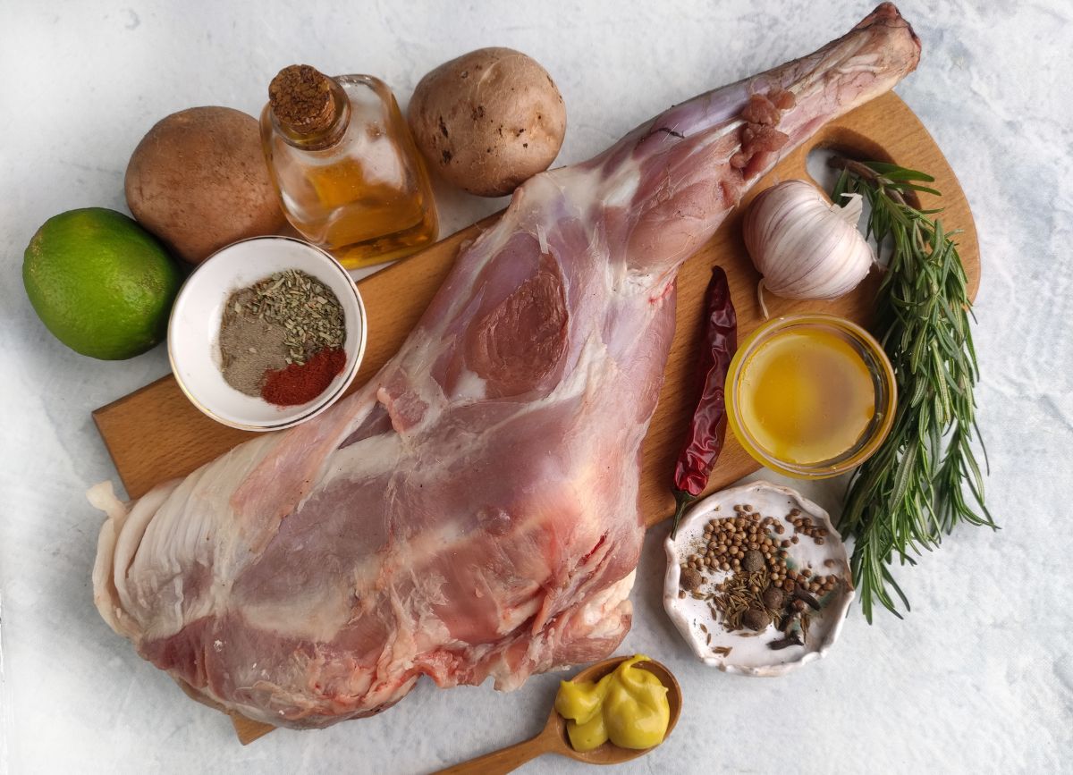 Ingredients needed to make a roasted leg of lamb.