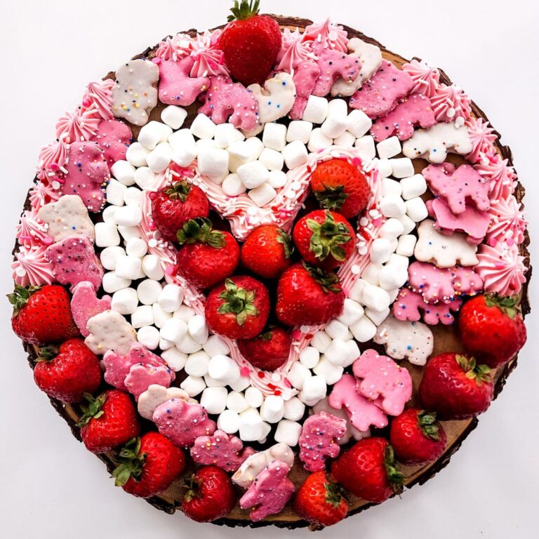 A charcuterie board made from dairy and gluten free ingredients in the shape of a heart.