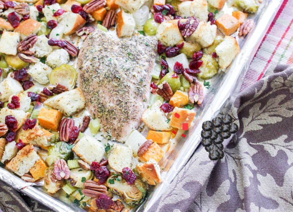 A baking sheet of veggies and turkey breast.