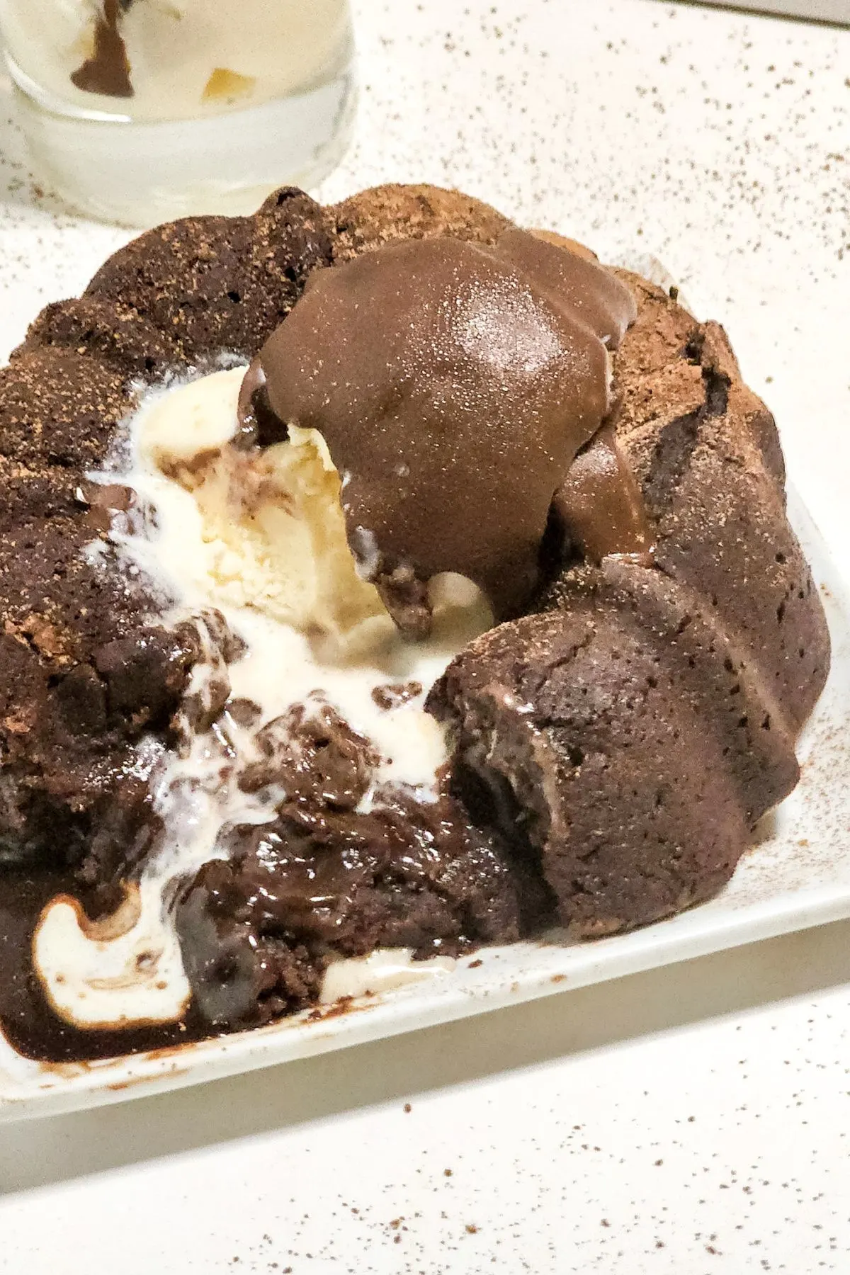 A dairy free chocolate molten lava cake on a plate. 