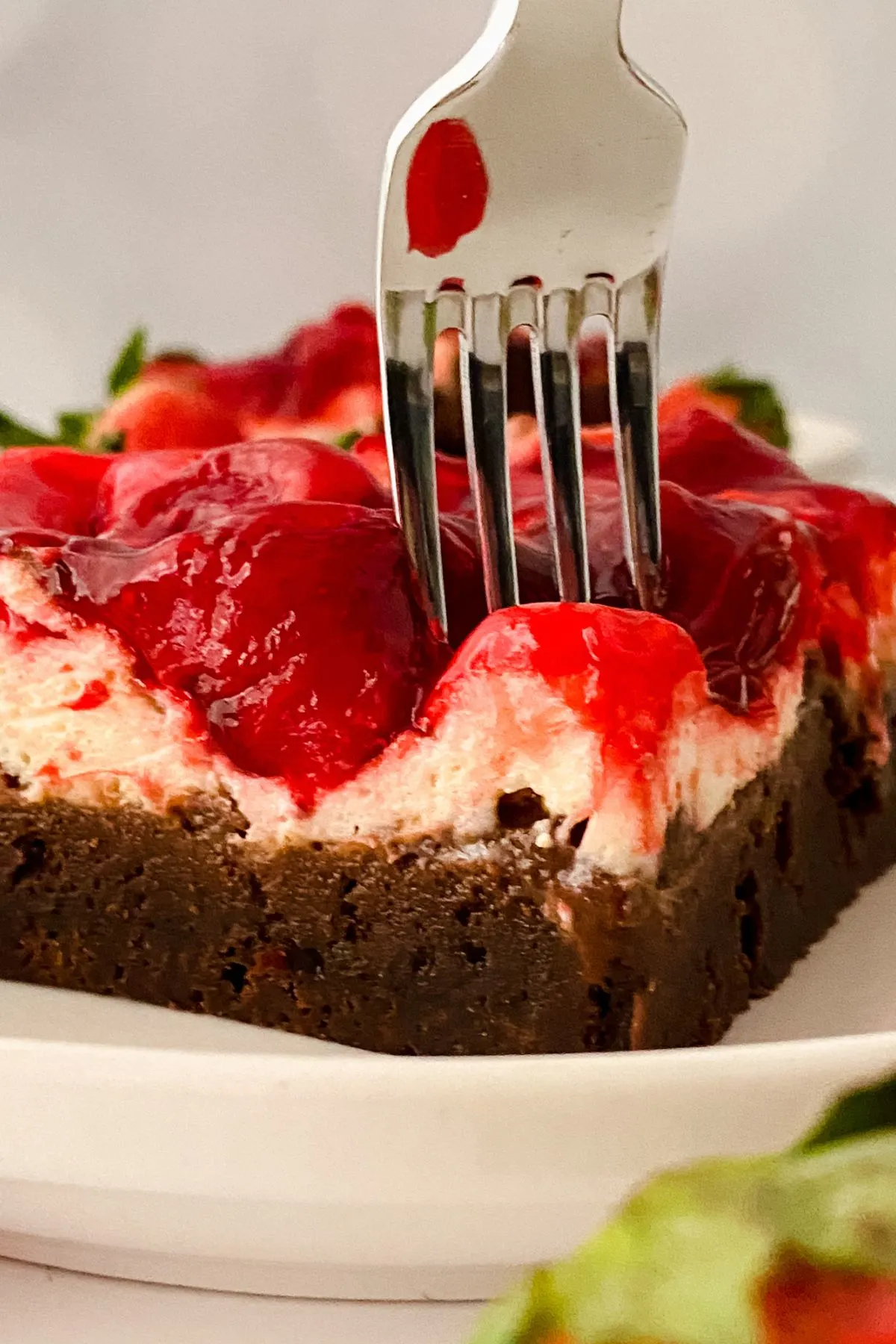 A fork in a Strawberry Cheesecake Brownie.