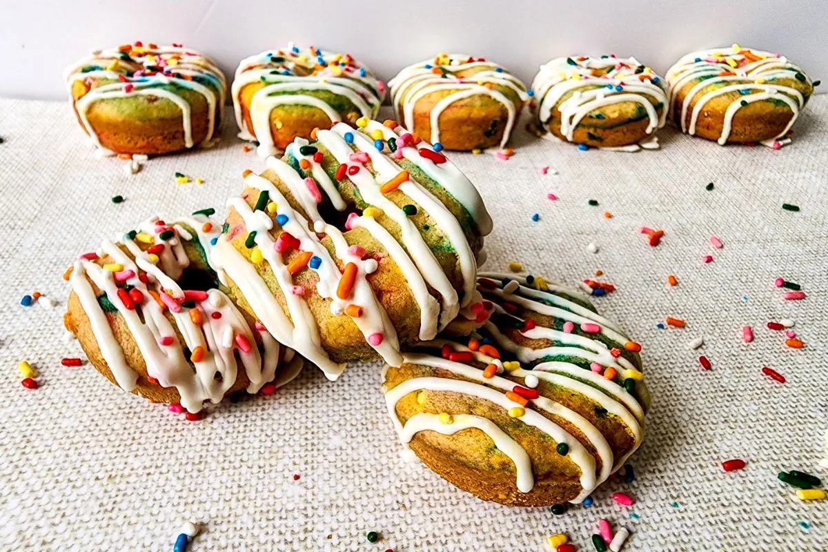 A bunch of funfetti homemade donuts.