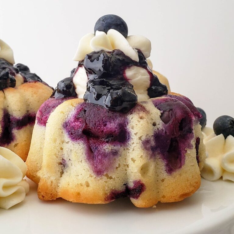 Close up looking at a homemade lemon and blueberry mini bundt cake.