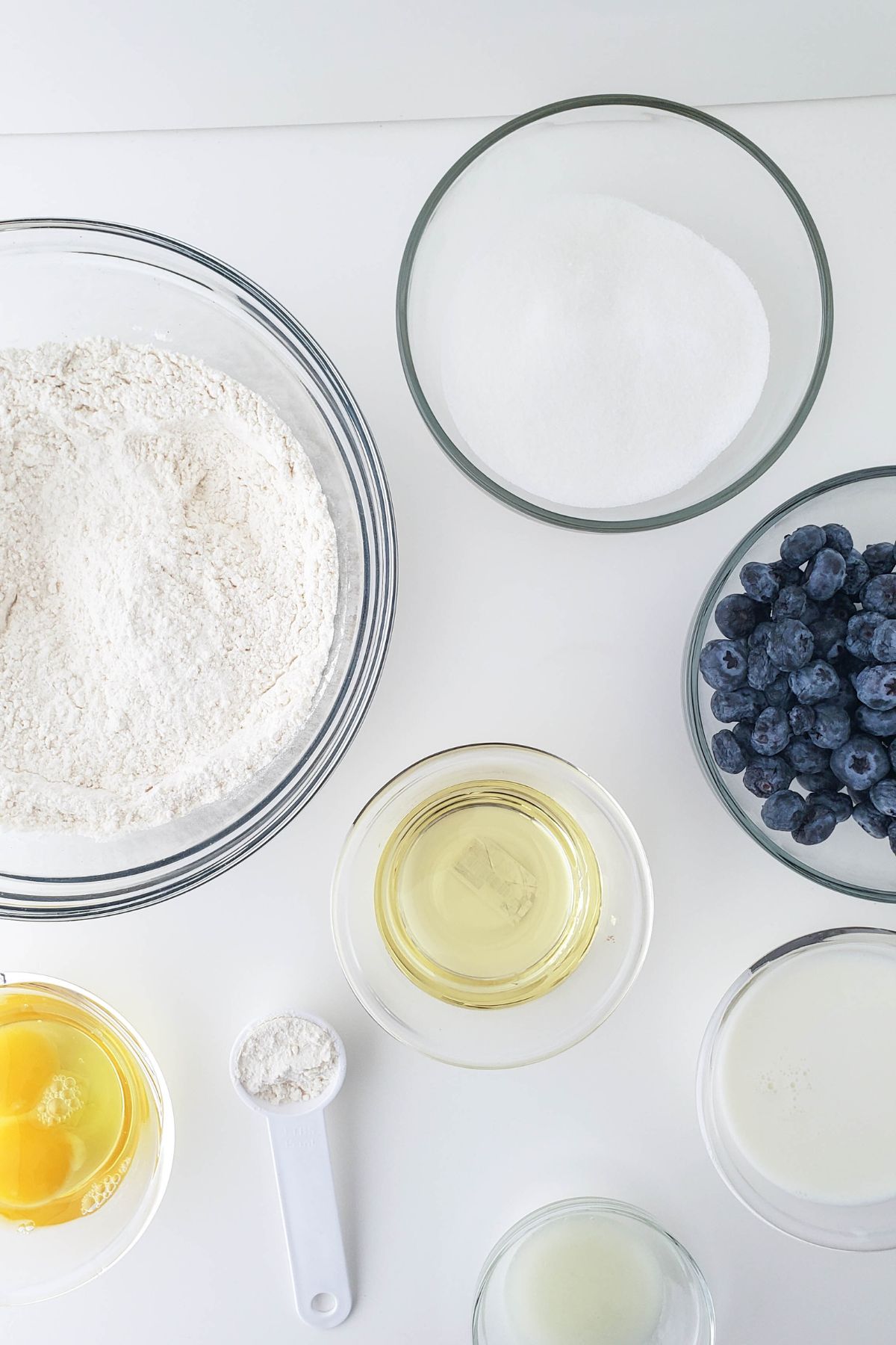 Ingredients needed to make mini lemon and blueberry bundt cakes.