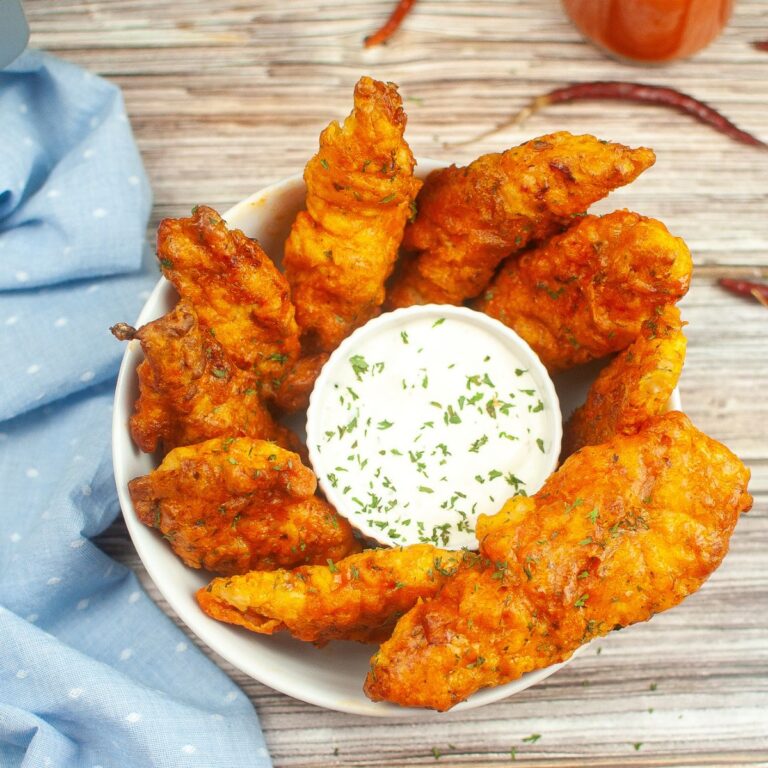 A serving bowl of air fried chicken tenders.