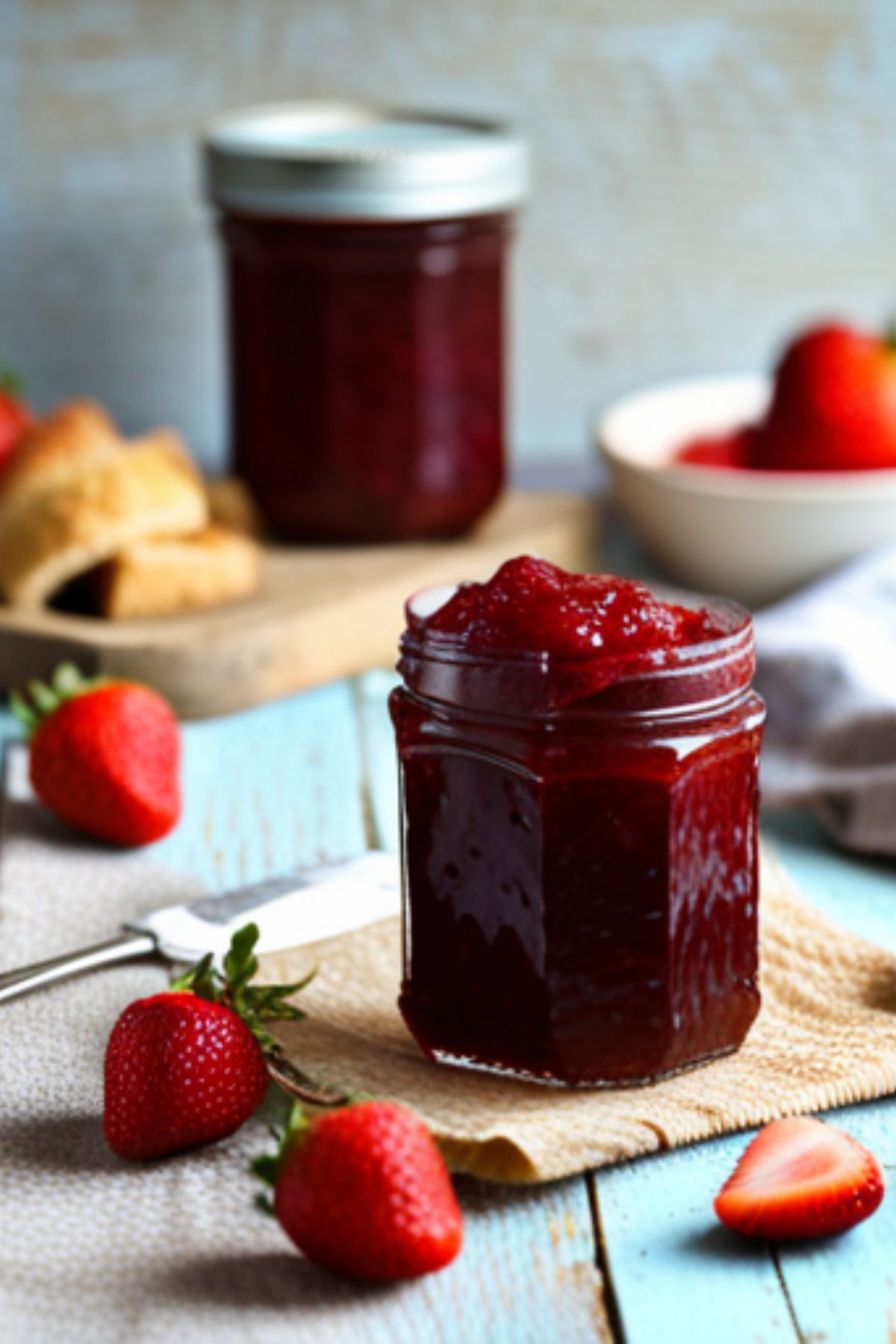 A jar of homemade gluten free strawberry jam.