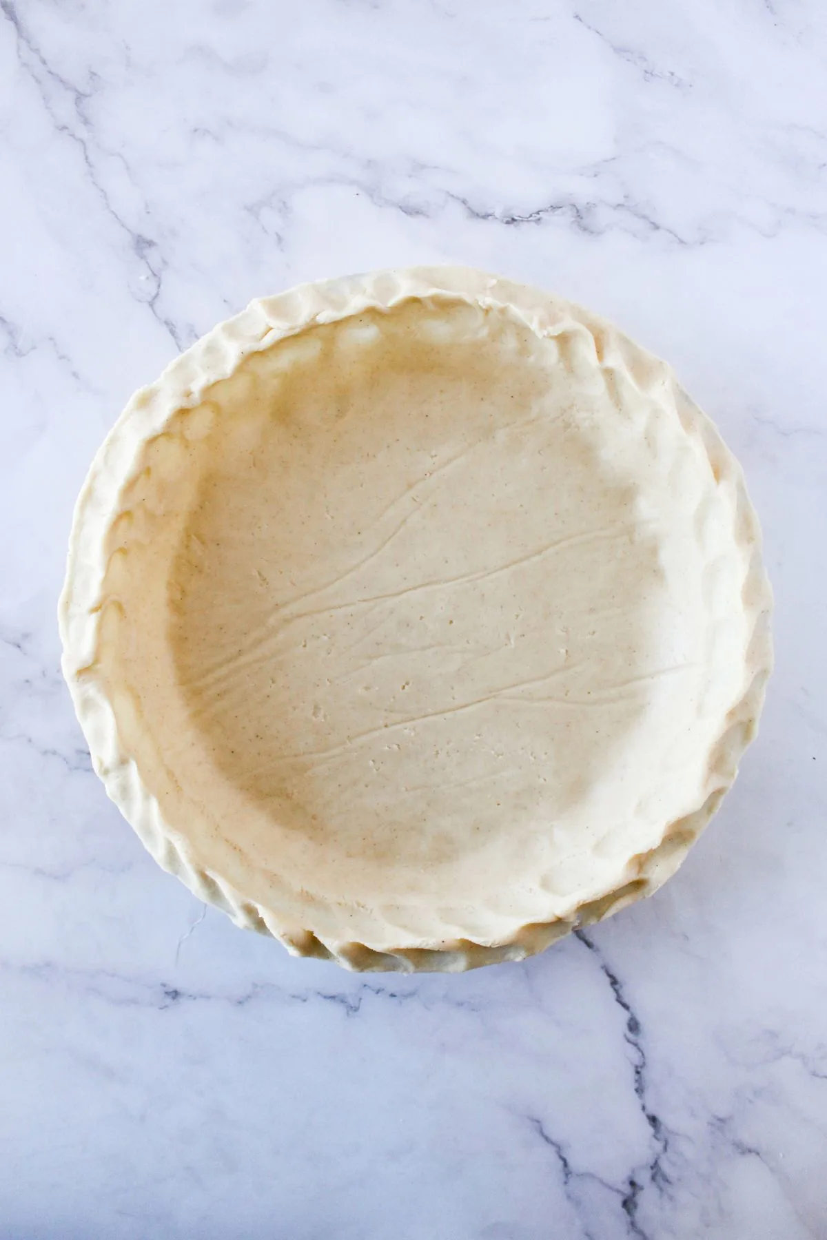 Looking down on a glute free pie crust to be baked.