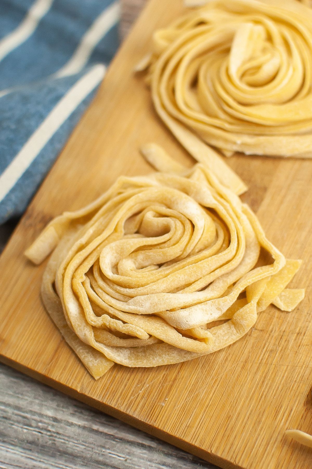 Two small nests of gluten free fettuccine pasta.