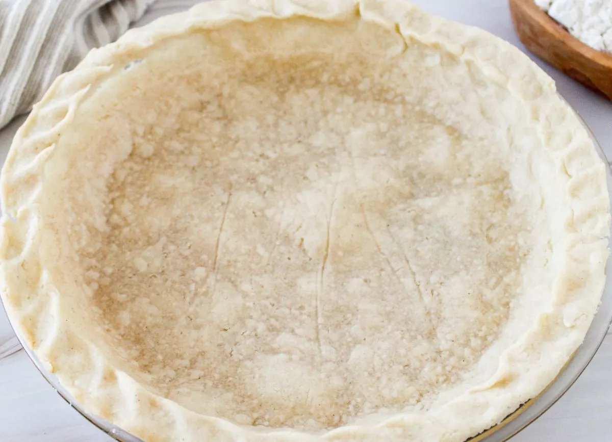 Looking down closely on a gluten free pie crust that was baked.