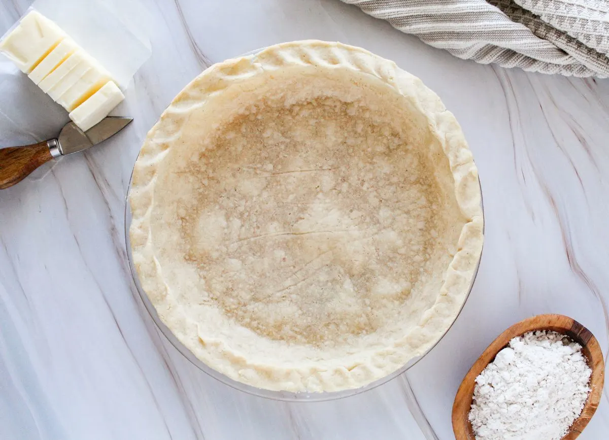 Looking down on a pie crust made from gluten free ingredients.