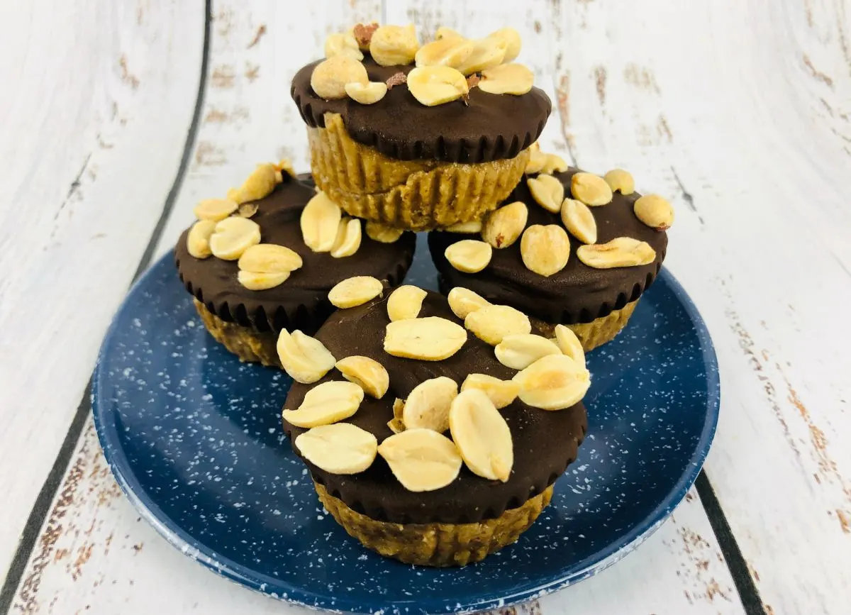 A small stack of Snickers Cups on a blue plate.