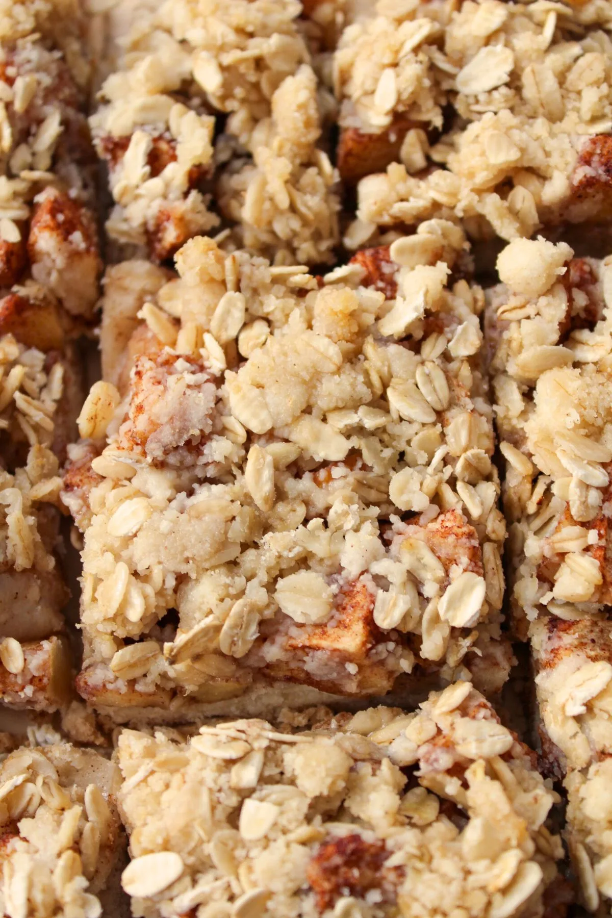 Looking down on a bunch of cut Gluten Free Apple Crumble Bars.