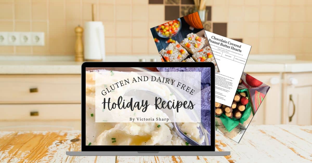 Gluten and dairy free Holiday Recipes cookbook open on a computer in a kitchen